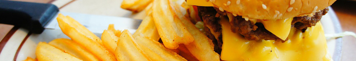 Eating Burger at Burgers By Biggs restaurant in Lawrence, KS.